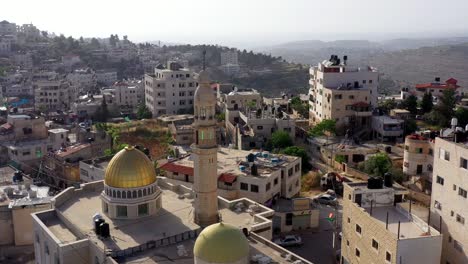 aerial view over golden dome mosque in palestine town biddu,near jerusalem