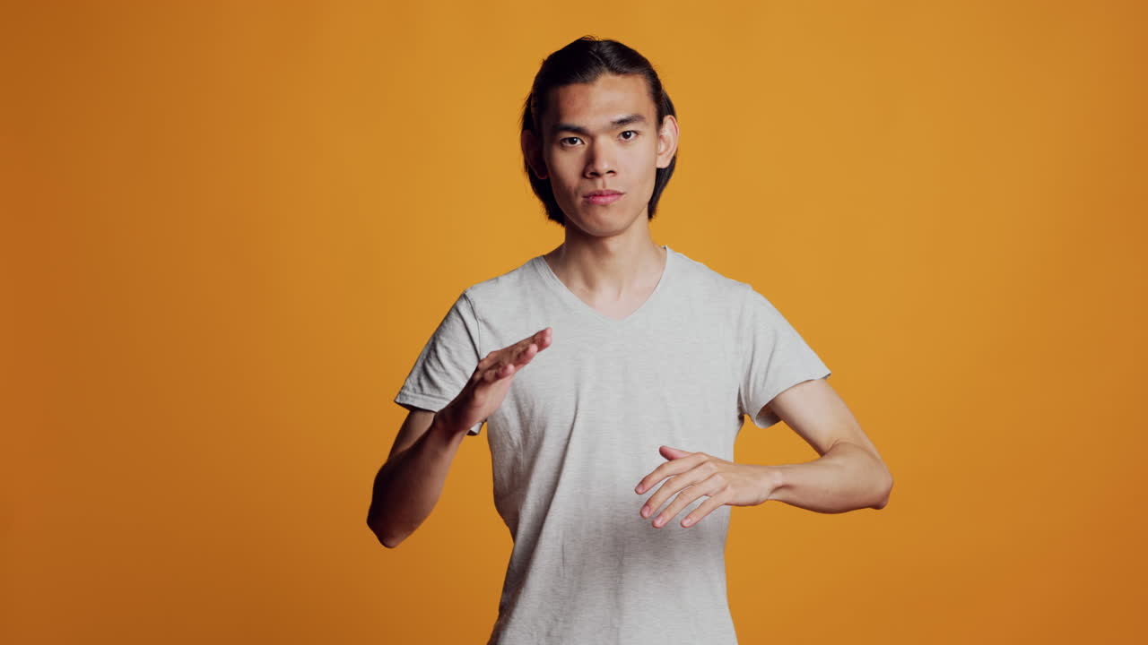 Positive person showing robotic dance moves on camera