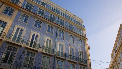 historic building facade with typical blue azulejo ceramic tiles in porto, portugal