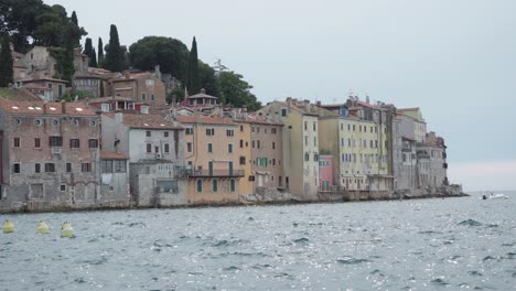 A captivating exterior view of Rovinj showcasing a blend of modern and historic architecture along the coastline.