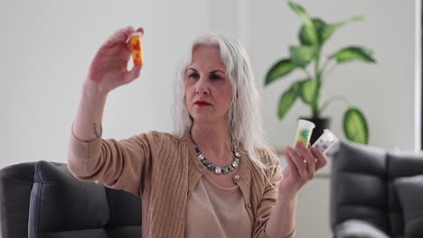 elderly woman examining multiple medication bottles