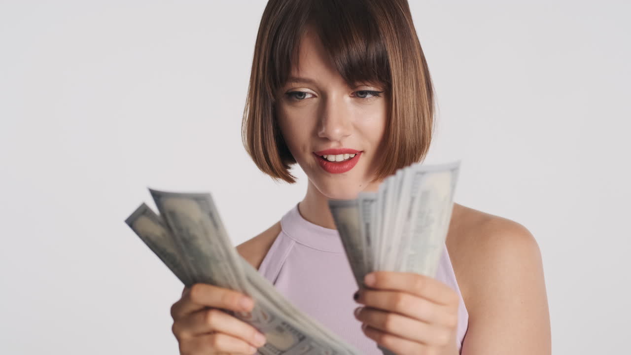 Happy woman holding banknotes