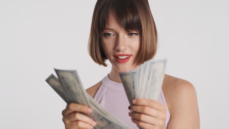 happy woman holding banknotes