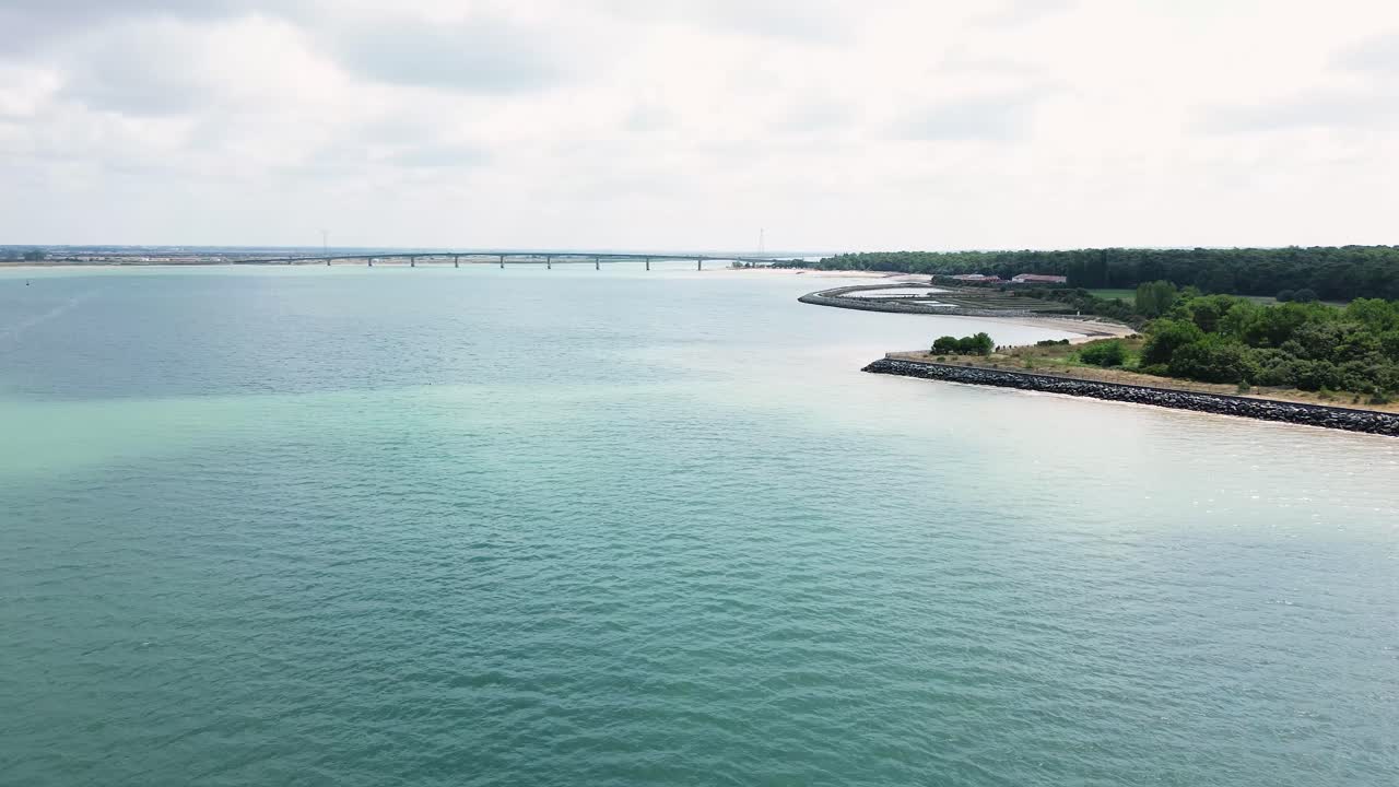 Drone footage capturing the stunning coastline of Île d’Oléron in Charente-Maritime, France, under bright summer sunshine