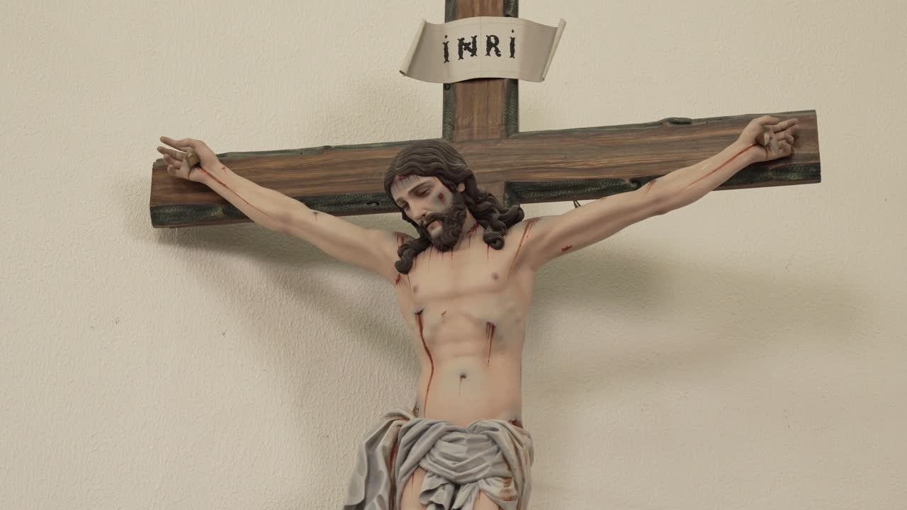 crucifix featuring Jesus Christ on a wooden cross inside a church