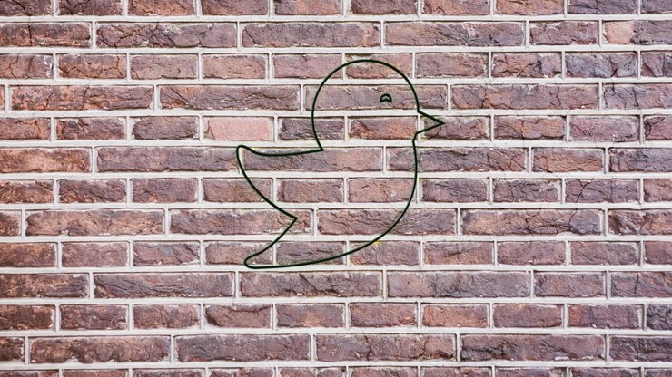 Animation of glowing neon bird icon on brick wall