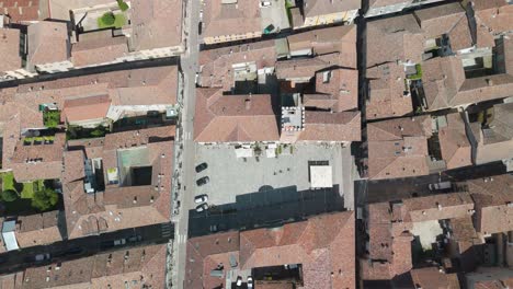 nizza monferrato, unesco site, asti, piedmont, italy. 4k aerial view of the city hall and central square. langhe-roero and monferrato. top down zenital descending.