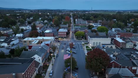 American-flag-waving-in-town-square-during-dusk