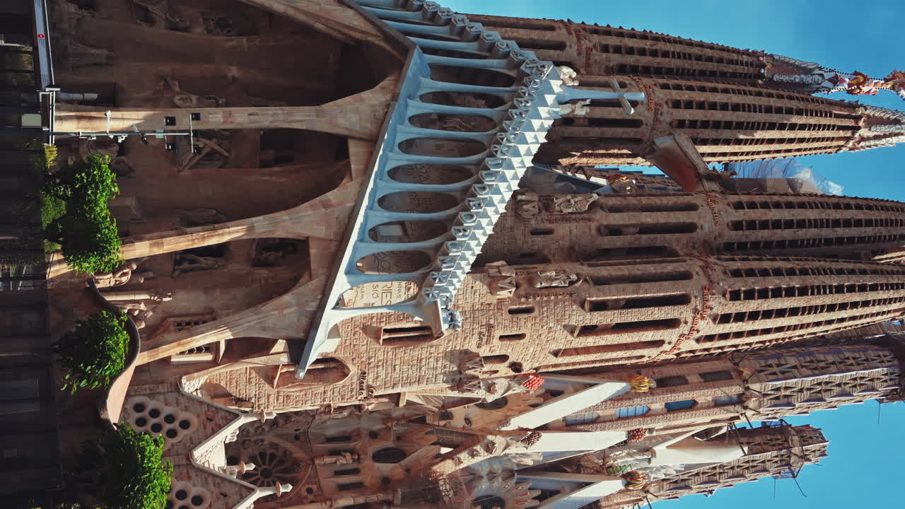 The Sagrada Familia and construction works in Barcelona, Spain. Vertical view
