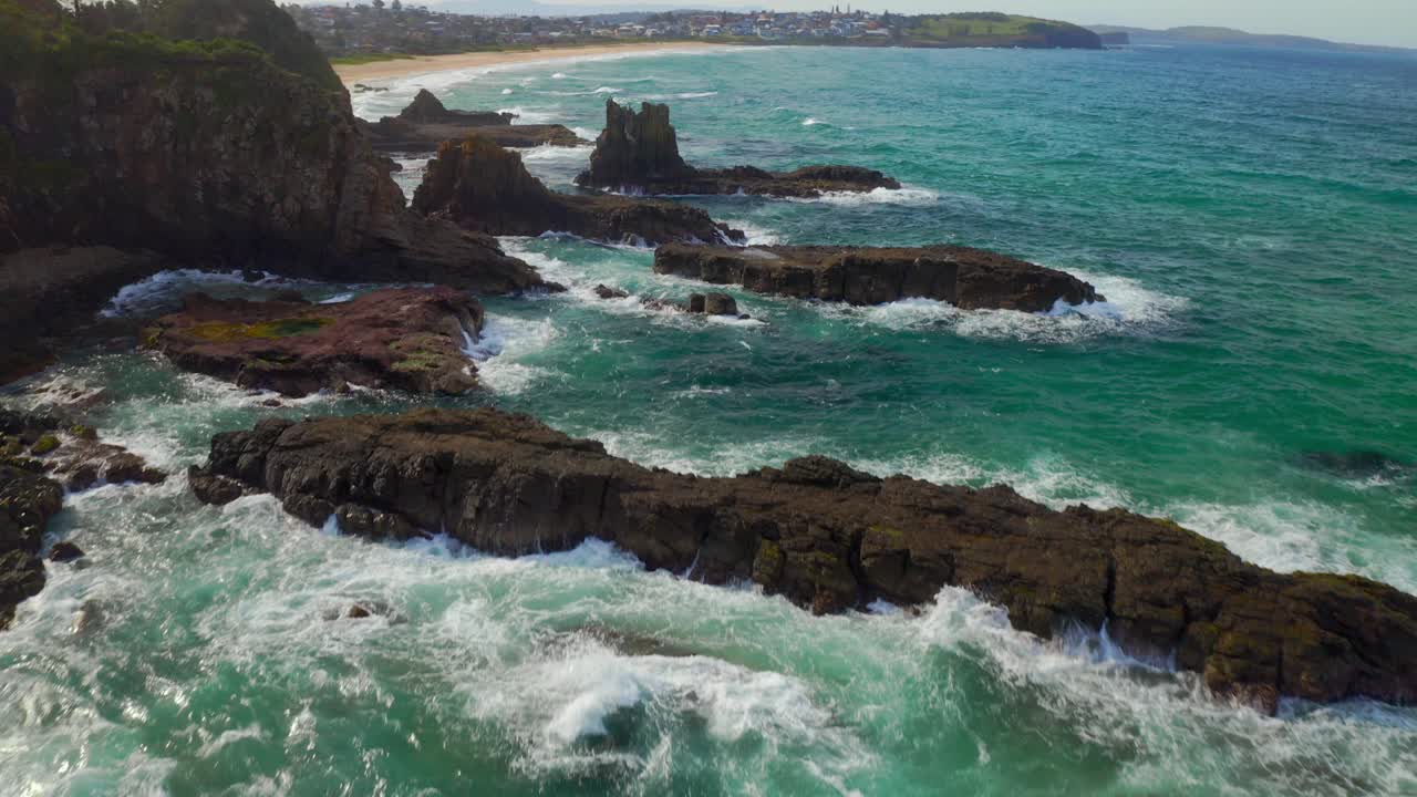 Tilt-up aerial View Of Rocky Coastline Around The Cathedral Rocks, Kiama, NSW, Australia