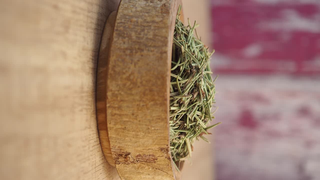 Dried Rosemary in a Wooden Bowl