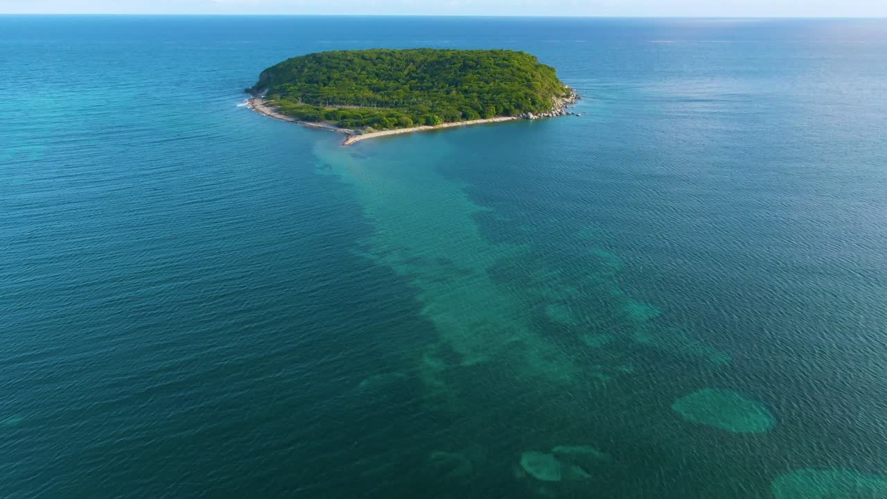 Aerial View of a Lush Tropical Island in the Turquoise Ocean