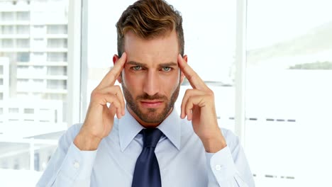 businessman having a migraine