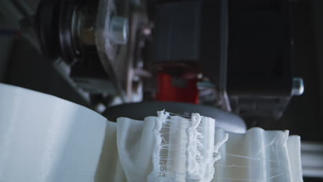 close-up of a 3d printer creating an object with intricate details