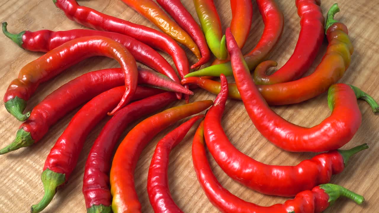 Red chilli, pepper. Shooting in the movement. Shooting in kitchen
