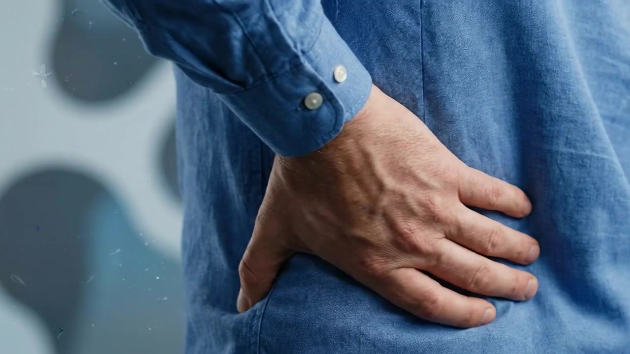 Person holding painful lower back and hip in close medical symptom view