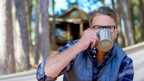 man having coffee while relaxing in a hammock 4k