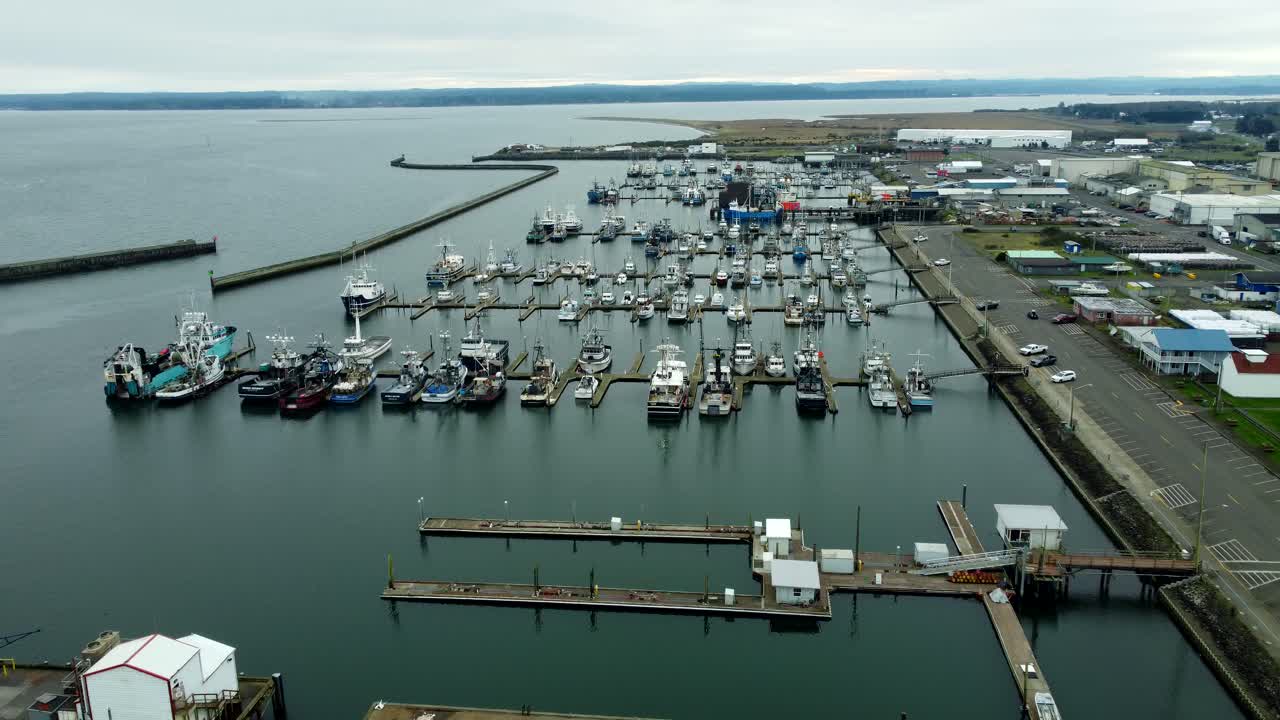 US, WA, Westport, 2025-10-28 - Drone view of the harbor with ships, rocks, buildings, fishing, bay