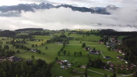 4K-drone-shot-of-beautiful-misty-sunrise-at-Ramsau-am-Dachstein,-Styria,-Austria