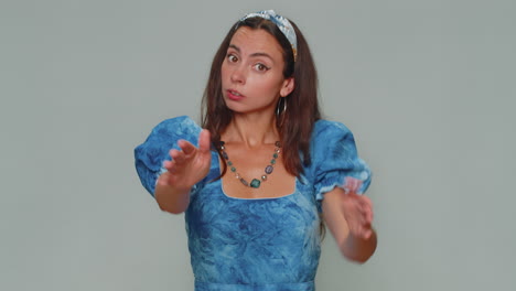 woman warning with admonishing finger gesture, saying no, be careful avoid danger, disapproval sign