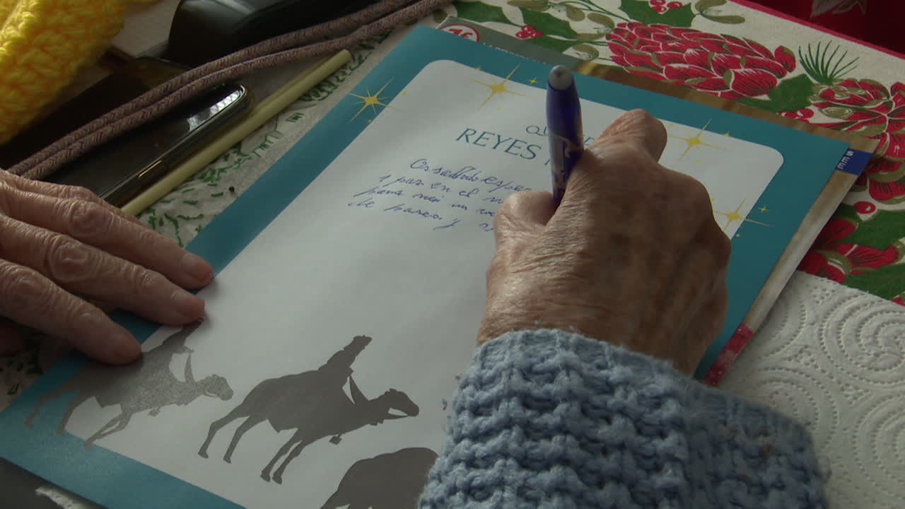 Elderly Person Writing a Christmas Letter