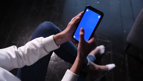 touching, zooming, tapping and sliding on blue chroma key smartphone screen.