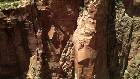 drone footage provides an intense, up-close view of the rock wall in zion national park