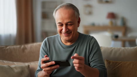 older man using a smartphone
