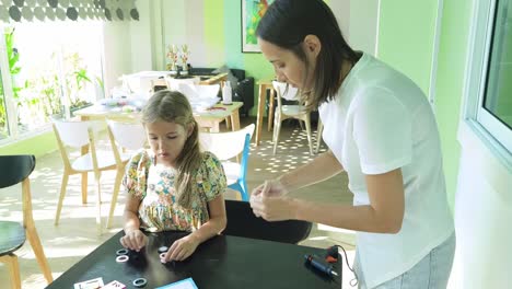 mother and daughter crafting together