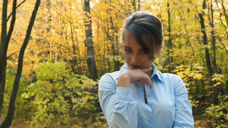 woman posing in park. happy young woman posing in autumn park