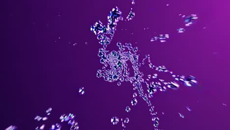 Dynamic video of water droplets captured from a low-angle, creating a mesmerizing, abstract pattern