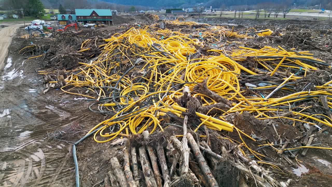 4K Aerial Drone Video of Pile of Pipes and Debris at Plastic Pipe Factory Near Interstate 26 in Erwin, TN Caused by Flooding after Hurricane Helene (2024)