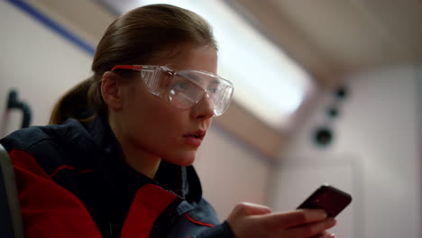 Medical-worker-using-smartphone-in-ambulance-car