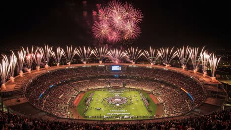 a spectacular celebration of joy and triumph illuminates the night sky with dazzling fireworks above a packed stadium filled with enthusiastic fans