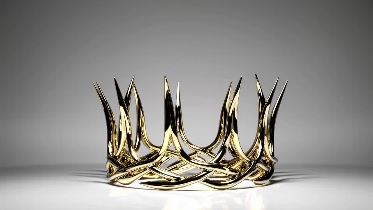 A rotating close-up of an ornate golden crown on a reflective surface, shot from a low angle