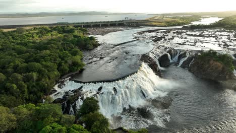 slow motion with a lateral movement with a drone in front of this waterfall