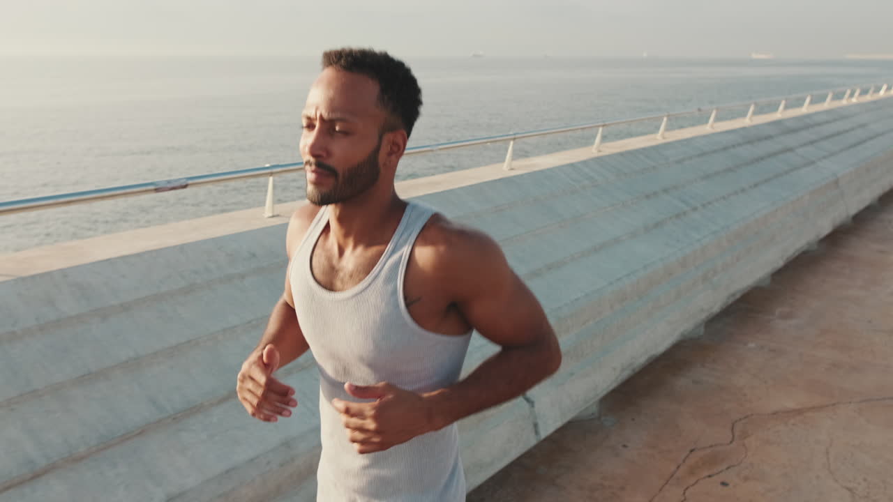 Man running by the ocean