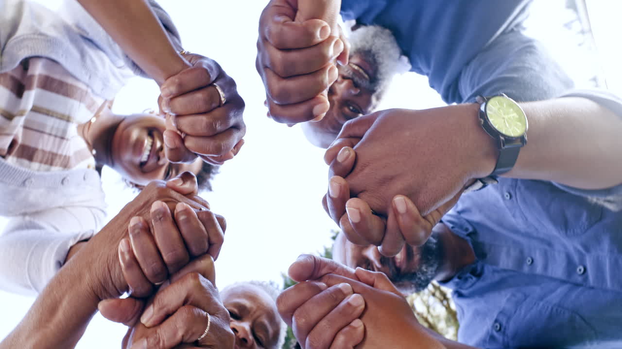 Hands, prayer and a black family in a circle