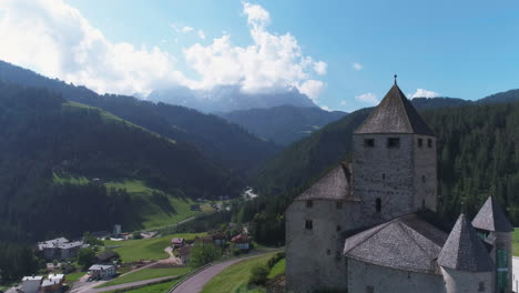 drone view of a church in the dolomites, italy