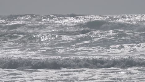 high surf and wind at a northern california beach in monterey county