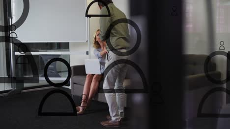 animation of social media icons and data processing over diverse business people in office