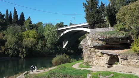 bride and groom under the bridge