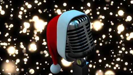 Animation-of-glowing-gold-lights-over-microphone-with-christmas-hat-on-dark-background