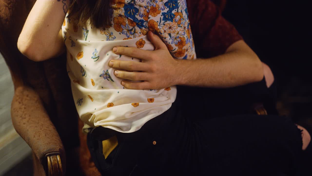 Couple touch each other as the make out