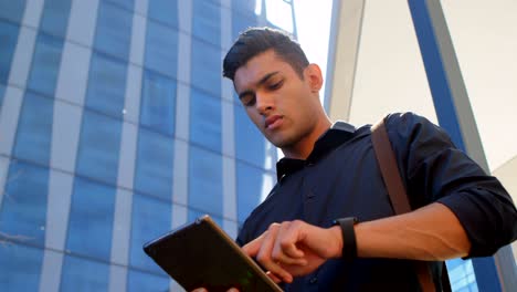 male commuter using digital tablet in office premises 4k