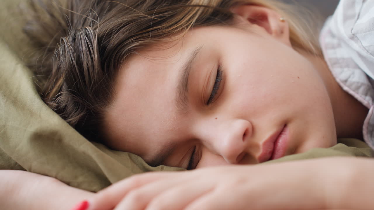 Teen Resting Peacefully On Bed, Young Person Sleeping Soundly In Gentle Morning Light, Teenage Student Peacefully Dozing On Pillow Amid Soft Morning Illumination And Tranquil Surroundings