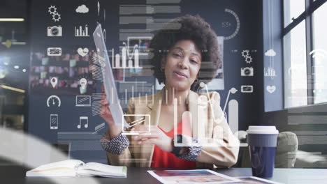 smiling woman holding photo with data processing animation over office background