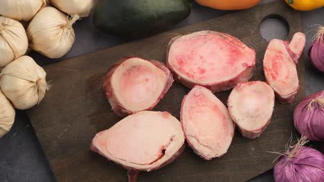 raw beef bones for broth preparation with vegetables