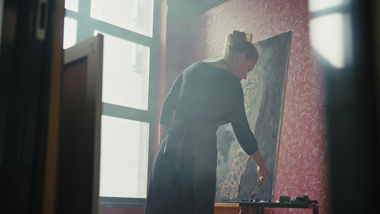Woman Painting a Leopard Portrait in an Art Studio