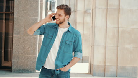 man talking on phone in city